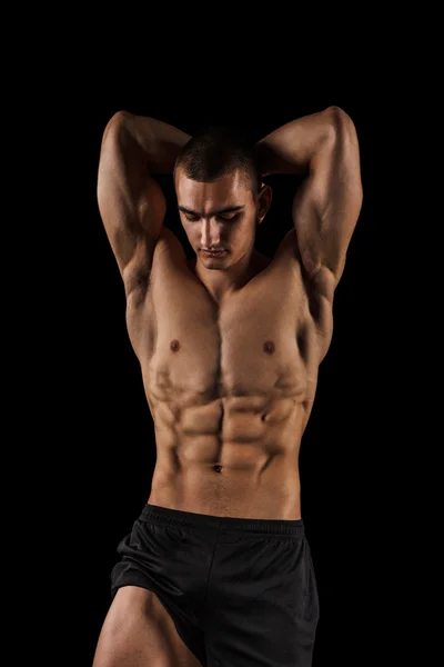 Fitness muž izolovaných na černém pozadí — Stock fotografie
