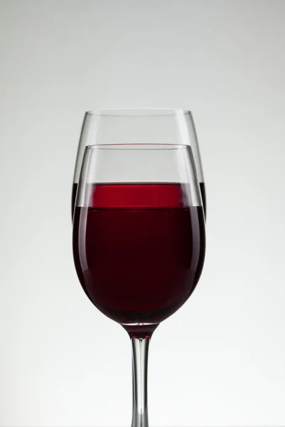 Wine in glass and bottle of wine on white — Stock Photo, Image
