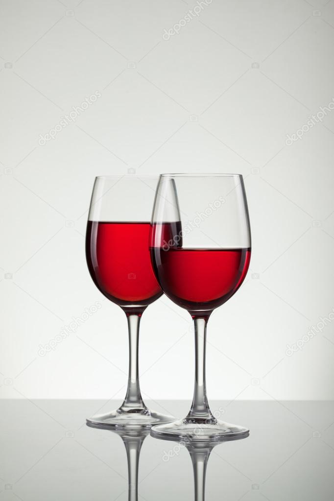 Wine in glass and bottle of wine on white
