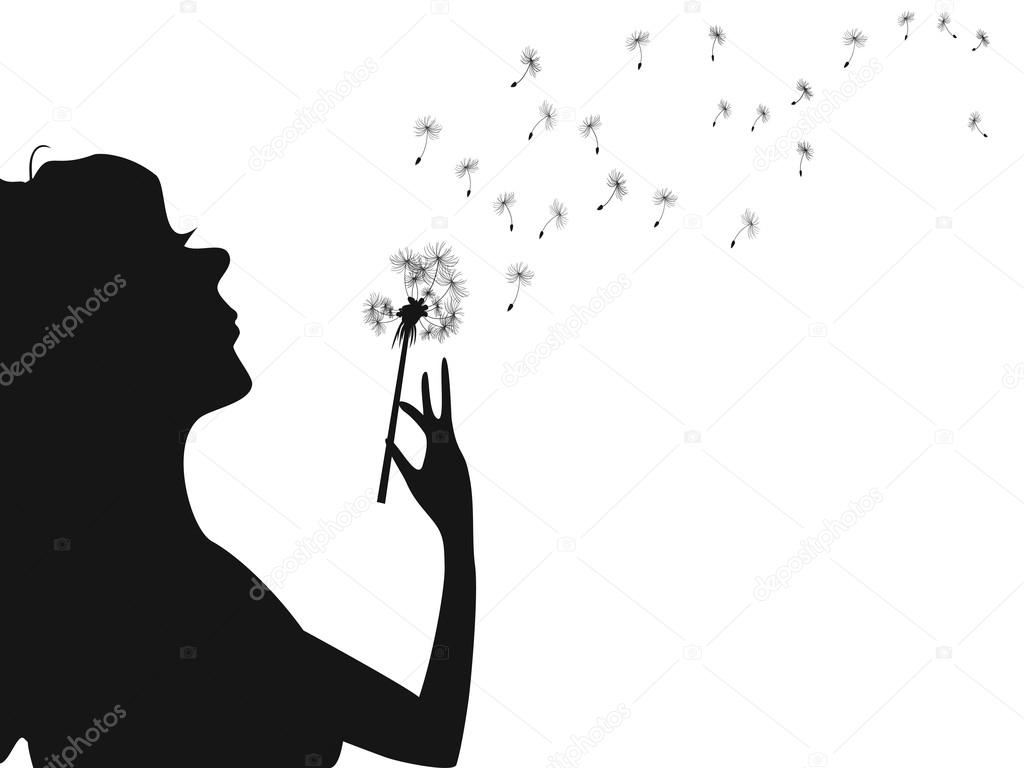 Silhouette of woman blowing dandelion