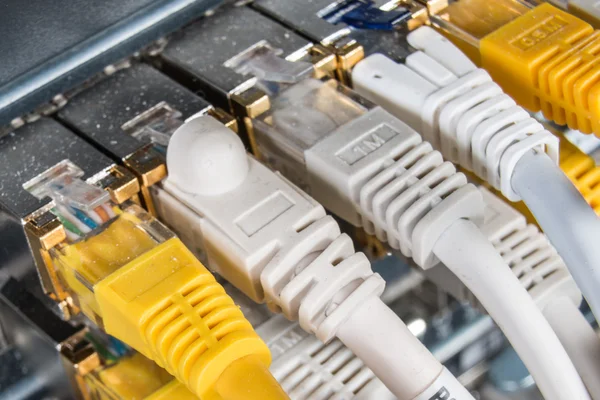 Network hub and patch cables — Stock Photo, Image