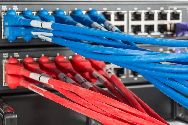 Network hub and patch cables — Stock Photo, Image