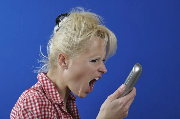 Woman screaming in the phone — Stock Photo, Image