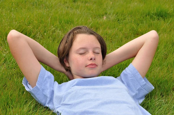 Girl asleep on the lawn — Stock Photo, Image