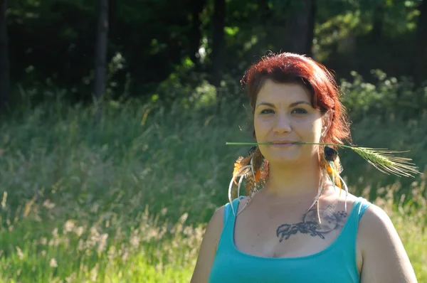 Woman in a meadow — Stock Photo, Image