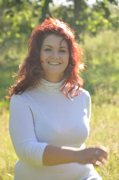 Woman in a meadow — Stock Photo, Image