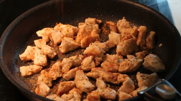 Frying sliced chicken meat frying pan close up. — Stock Video