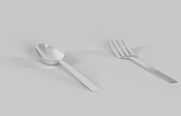 Cucchiaio e forchetta in metallo su sfondo grigio. — Foto Stock