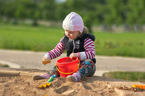 Adorable baby play with toys on sandbox — 스톡 사진