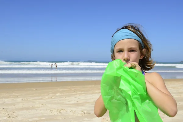 Child inflating inflatable swim ring — Stock Photo, Image