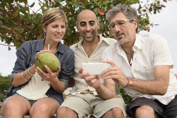 Group of friends with mobile phone Royalty Free Stock Photos