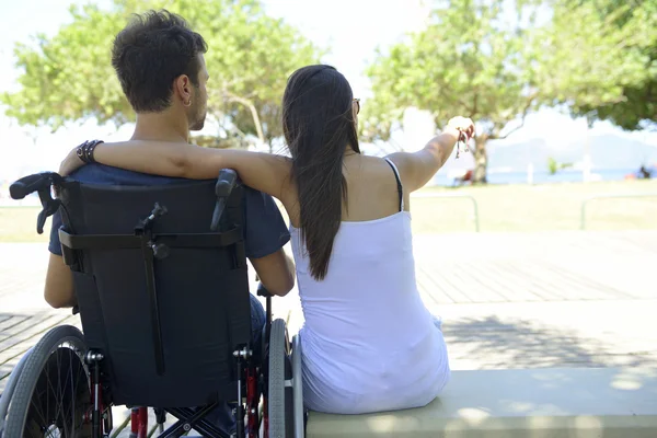 Man in wheelchair and girlfriend — Stock Photo, Image