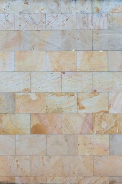 Modern rectangular sandstone wall texture, natural masonry background.