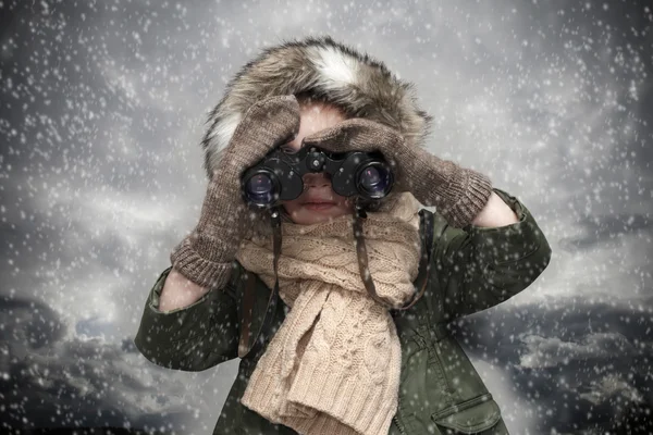 Small explorer with binoculars Stock Photo