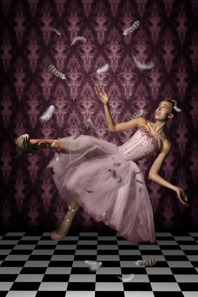 Levitation shot of a Woman and Feathers Stock Picture