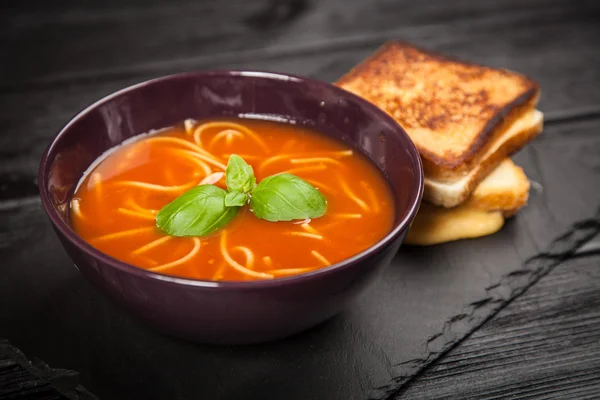 Tomato soup and basil — Stock Photo, Image