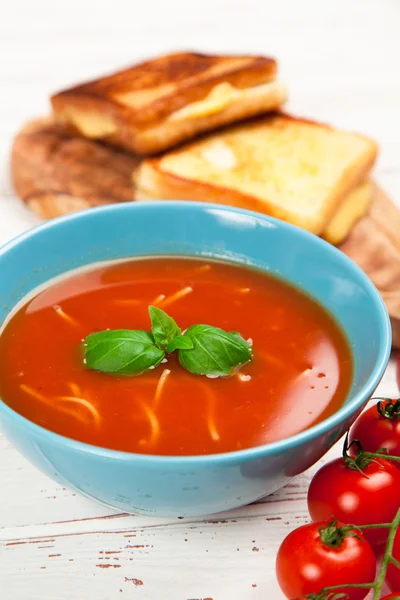 Tomato soup and basil — Stock Photo, Image