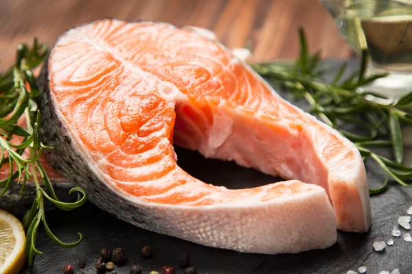 Fresh salmon on old wood — Stock Photo, Image