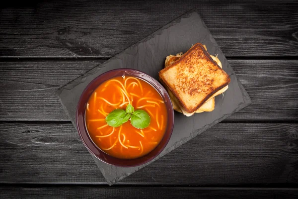 Tomato soup and basil — Stock Photo, Image