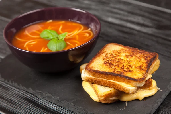 Tomato soup and basil — Stock Photo, Image