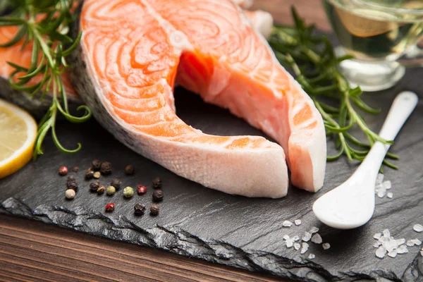 Fresh salmon on old wood — Stock Photo, Image