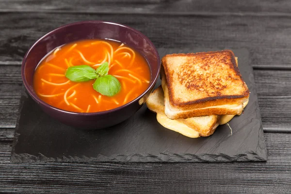 Tomato soup and basil — Stock Photo, Image