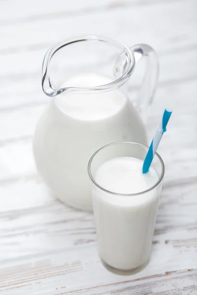Milk jar on wooden table — Stock Photo, Image