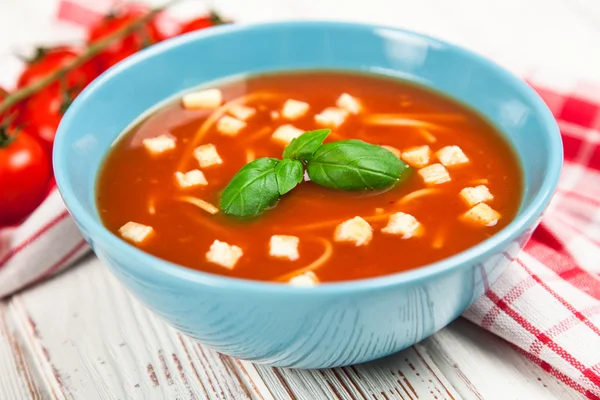 Tomato soup and basil — Stock Photo, Image