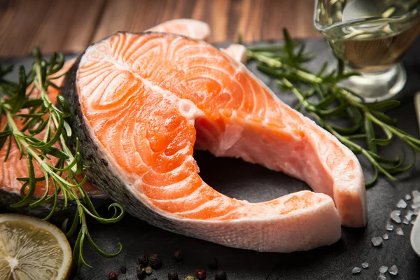 Fresh salmon on old wood — Stock Photo, Image