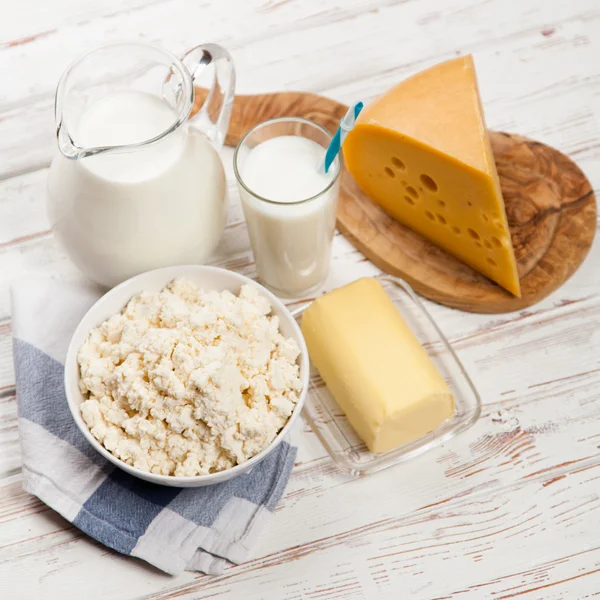 Milk jar on wooden table — Stock Photo, Image