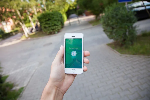 Pokemon Go game on screen of iPhone — Stock Photo, Image