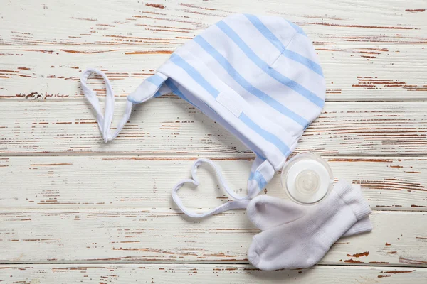 Baby clothes on wooden background — Stock Photo, Image