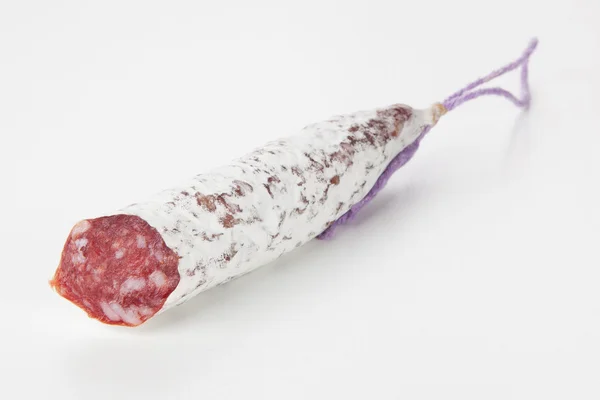 Salame sobre fundo branco — Fotografia de Stock