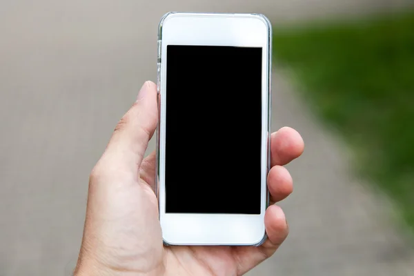 Smartphone in een hand — Stockfoto