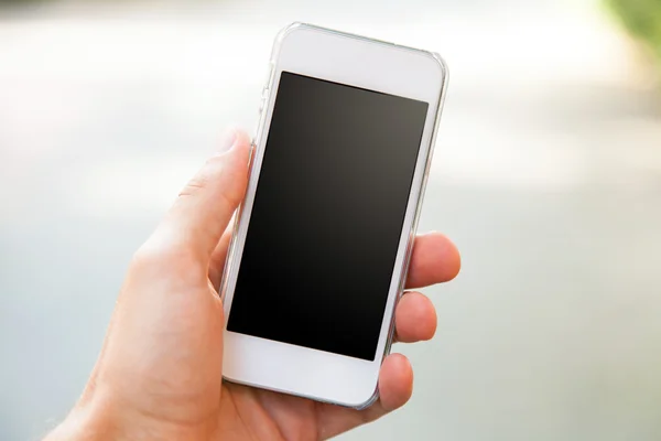 Smartphone in een hand — Stockfoto