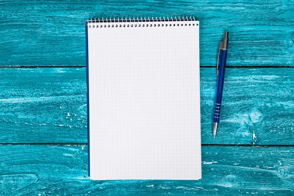 Blank notepad on blue painted wood — Stock Photo, Image