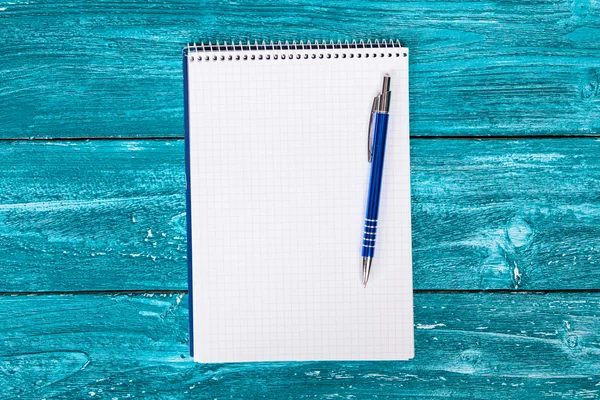 Blank notepad on blue painted wood — Stock Photo, Image