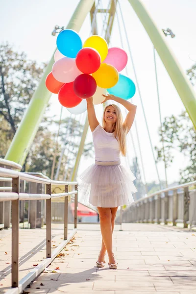 Young beautiful woman with balloons — Stock Photo, Image