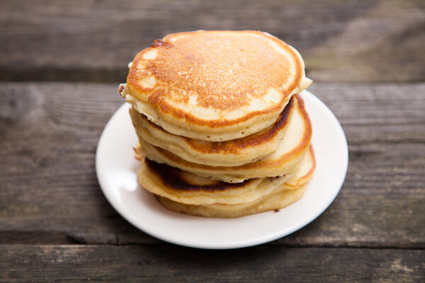 Delicious pancakes on a wooden table