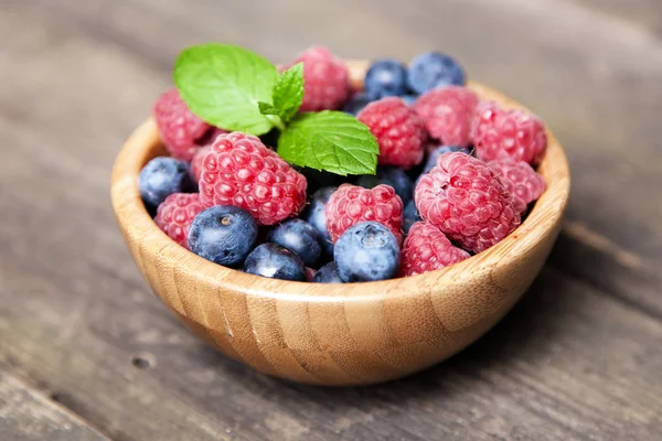 Fresh berries on a wooden table — Stock Photo, Image