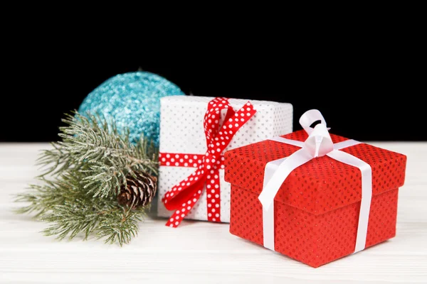 Christmas gift boxes in snow — Stock Photo, Image