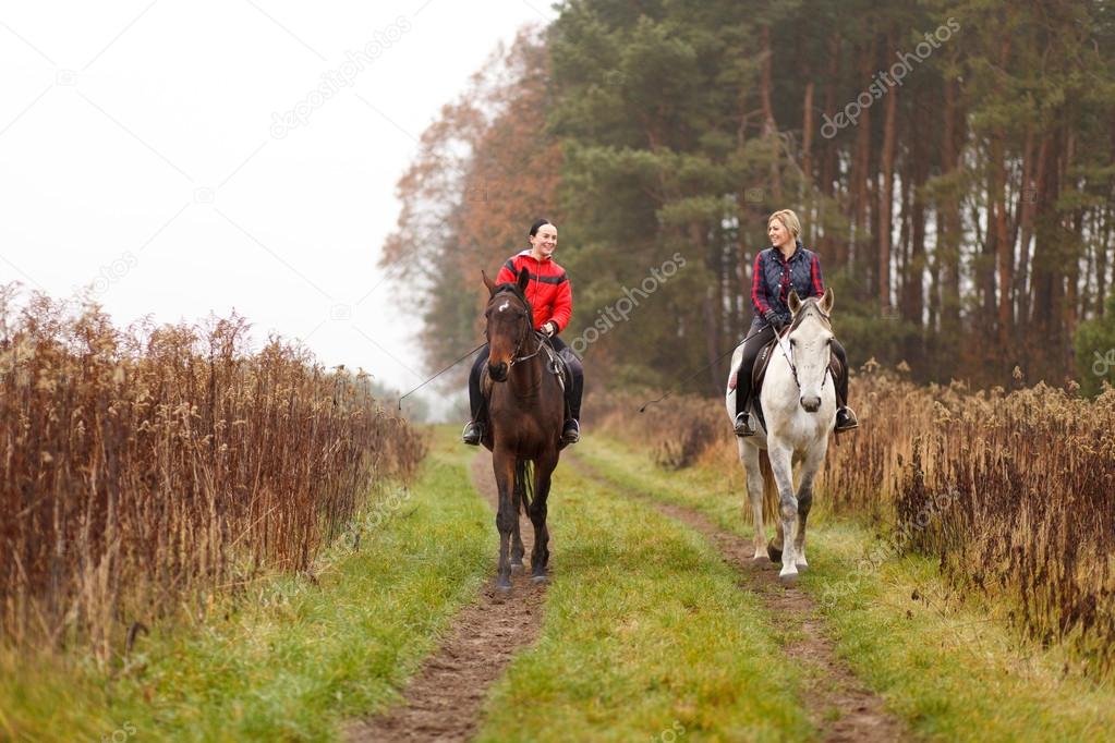 Young woman riding a horse