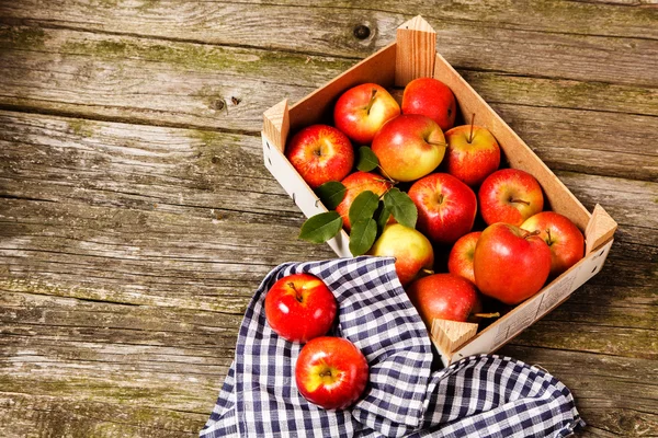 Fresh red apples on wooden table — Stock Photo, Image