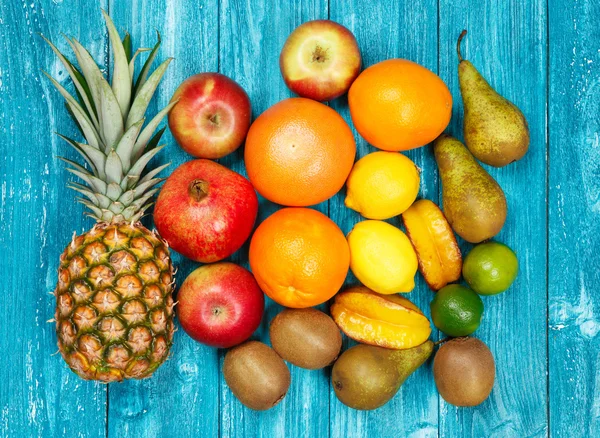 Set of colorful fruits on old wood background — Stock Photo, Image