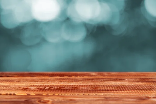 Wooden table on black background — Stock Photo, Image