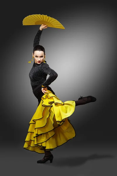 Flamenco dancer in a yellow skirt — Stock Photo, Image