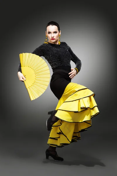 Flamenco dancer in a yellow skirt — Stock Photo, Image