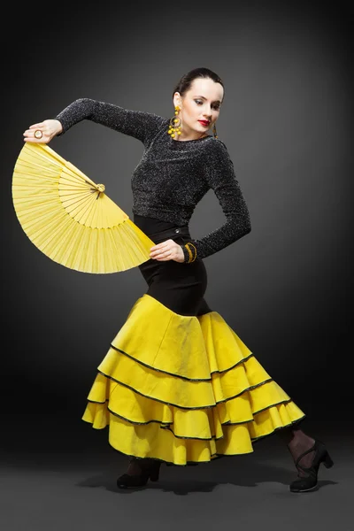 Flamenco dancer in a yellow skirt — Stock Photo, Image