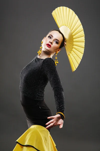 Flamenco dancer in a yellow skirt — Stock Photo, Image