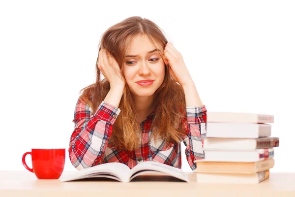 Chica joven estresada por sus libros de texto — Foto de Stock